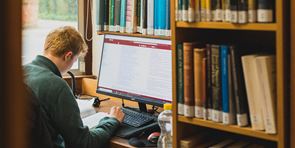 reader studying in the library