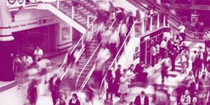 people moving in a train station 